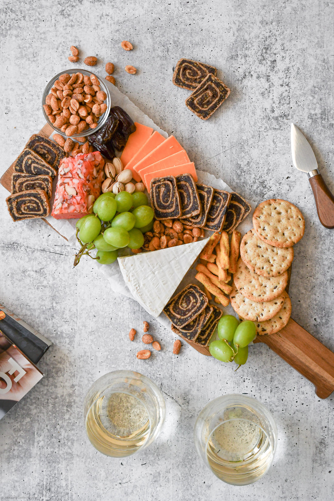 Moroccan Spice Date Swirls Cheeseboard paired with white wine