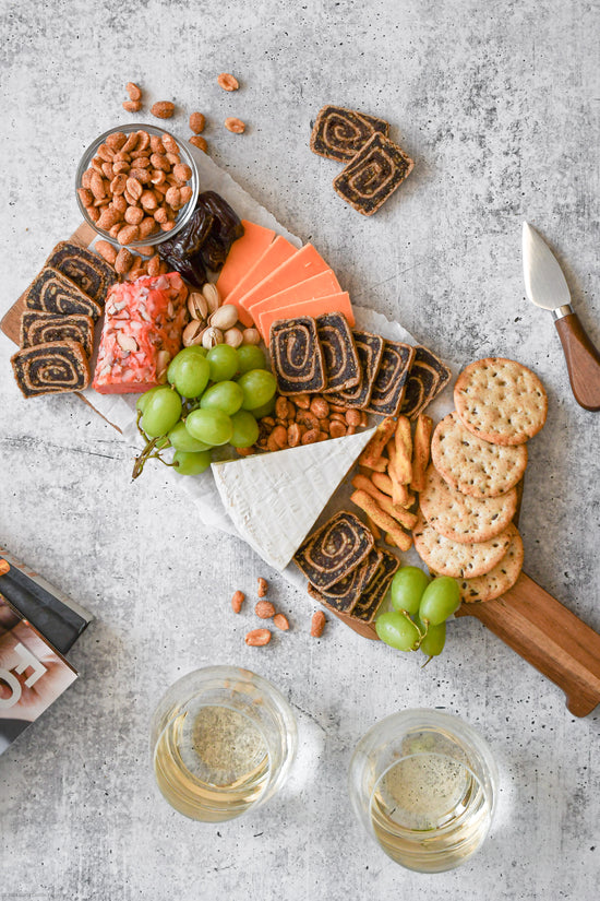 Moroccan Spice Date Swirls Cheeseboard paired with white wine